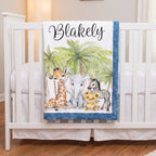 Personalized safari animal baby blanket with name draped over white crib rail