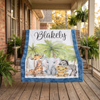 Personalized safari baby blanket draped over a porch swing with ferns and brick backdrop