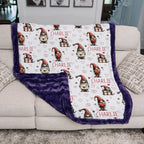 Blanket with gnome pattern and 'Charlie' text on a couch