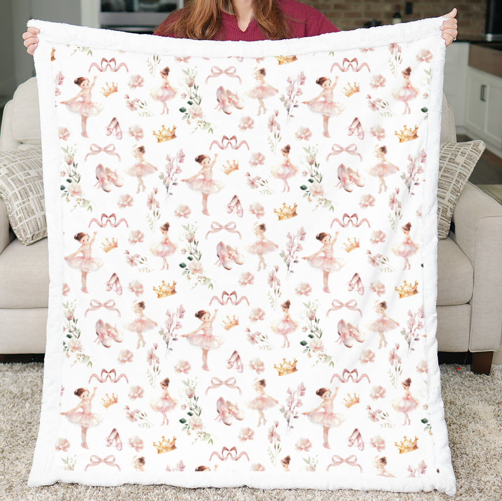 Person holding a blanket with ballerina pattern in a living room setting
