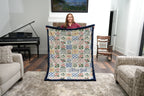 Corner detail of personalized floral patchwork blanket showing name in flowing script
