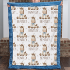 A personalized baby blanket with a blue minky fabric border and a white center printed with cartoon horses, the name 'BENTLEY', and small antler motifs. A child is holding the blanket up in front of a brick wall.