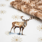 Close-up of winter elk minky blanket showing watercolor elk on snowflake design with Fawn Cappuccino backing
